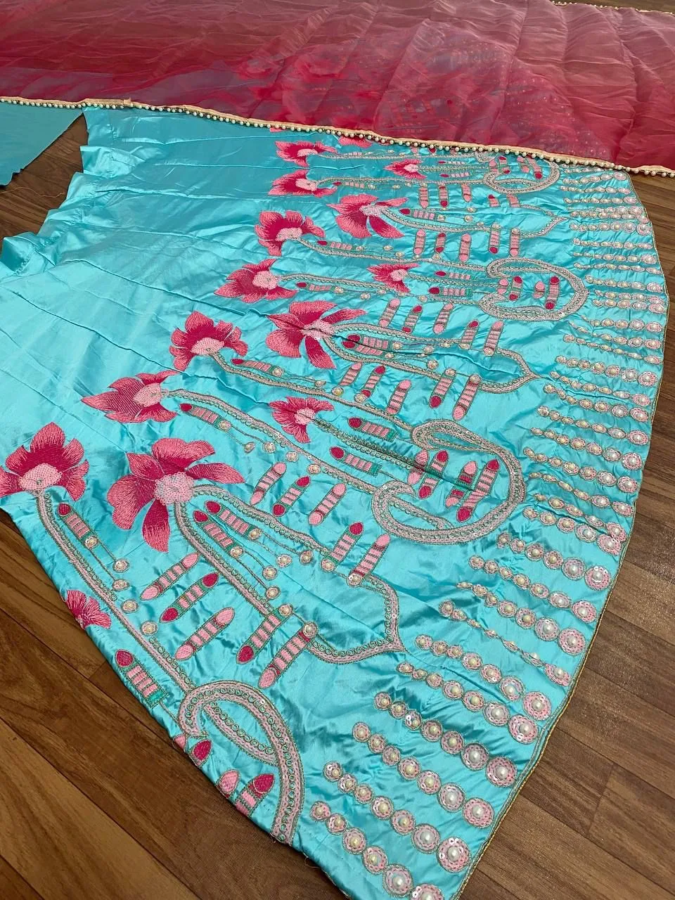 Dazzling Sky Blue Colored Malay Satin Silk Embroidery And Zari With Moti Hand Work Lehenga Choli